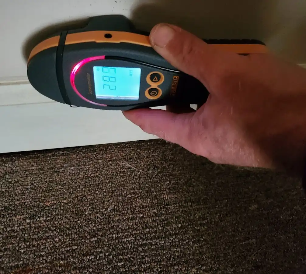 Moisture detection at baseboard during Storm Damage Restoration in Cape Canaveral